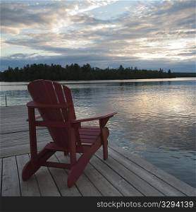 Muskoka chair on dock at Lake of the Woods, Ontario