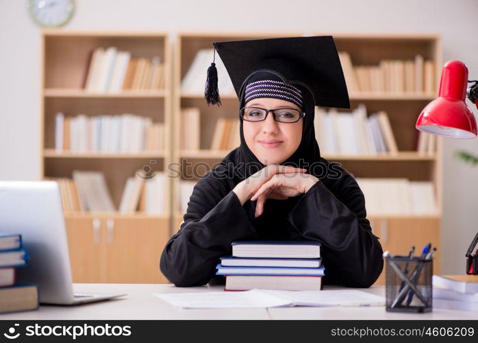 Muslim girl in hijab studying preparing for exams