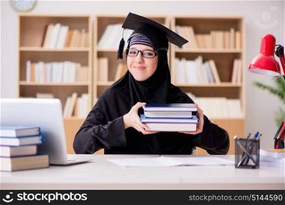 Muslim girl in hijab studying preparing for exams