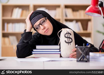 Muslim girl in hijab studying preparing for exams