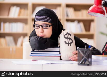 Muslim girl in hijab studying preparing for exams