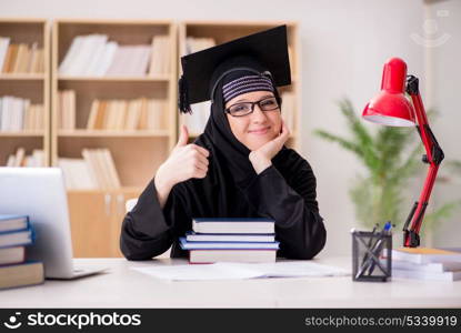 Muslim girl in hijab studying preparing for exams