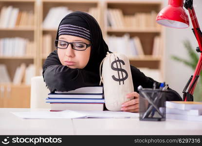 Muslim girl in hijab studying preparing for exams