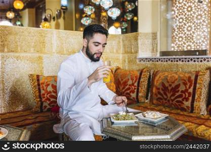 muslim man eating restaurant