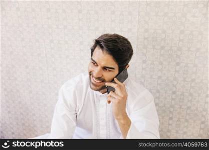 muslim man making phone call