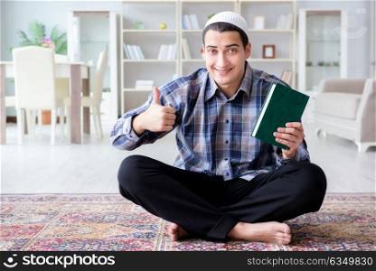 Muslim man praying at home