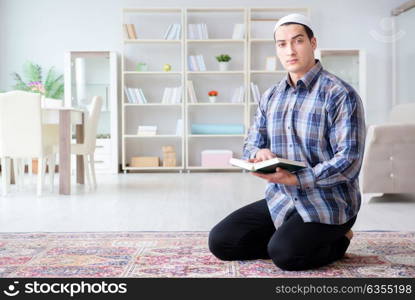 Muslim man praying at home