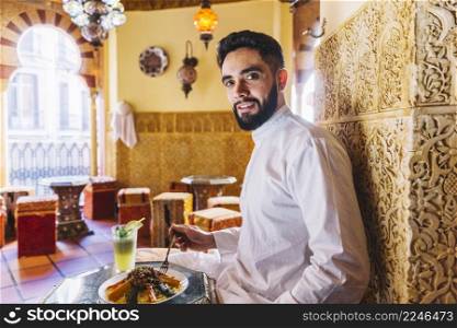 muslim man sitting restaurant