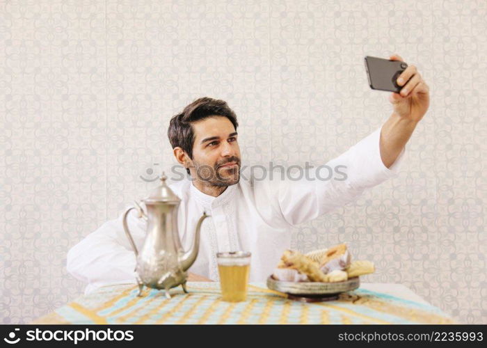 muslim man taking selfie_2