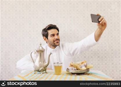 muslim man taking selfie_2