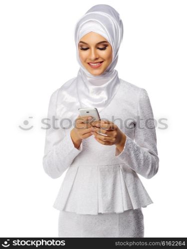 Muslim woman in white dress with phone isolated