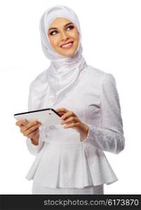 Muslim woman in white dress with tablet PC isolated