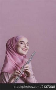 muslim woman playing flute