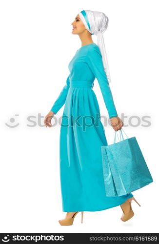 Muslim woman with bags isolated