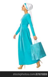 Muslim woman with bags isolated