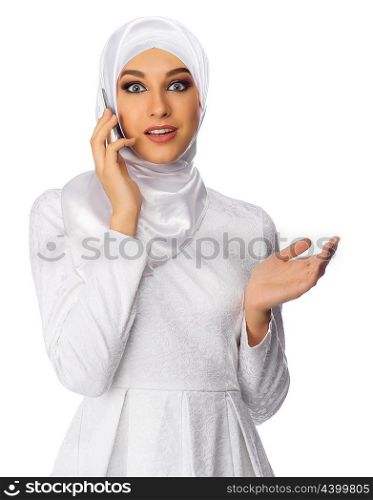 Muslim woman with mobile phone isolated on white