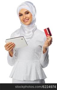 Muslim woman with tablet PC and credit card isolated