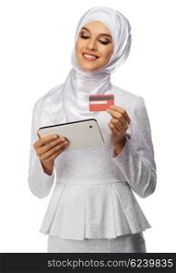 Muslim woman with tablet PC and plastic card isolated