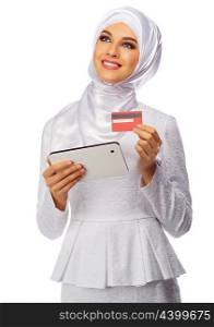 Muslim woman with tablet PC and plastic card isolated on white