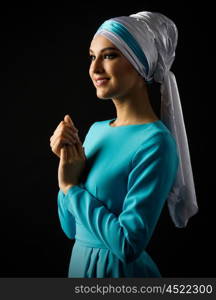 Muslim young girl on grey