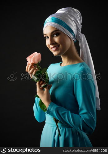 Muslim young woman on black