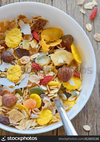 muslin cereal in a bowl on old wooden background