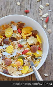 muslin cereal in a bowl on old wooden background