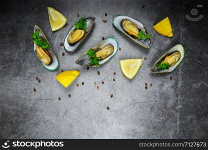 Mussels with herbs with lemon parsley stone table Top view with copy space / Steamed mussels served on plate seafood delicious on dining table restaurant