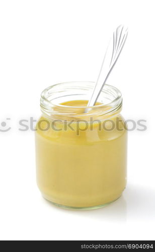 mustard sauce in jar isolated on white background