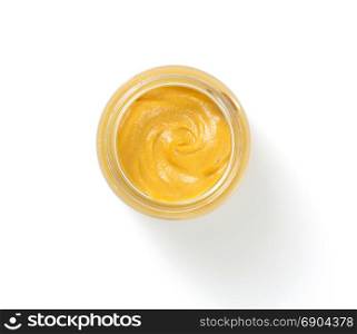 mustard sauce in plate isolated on white background