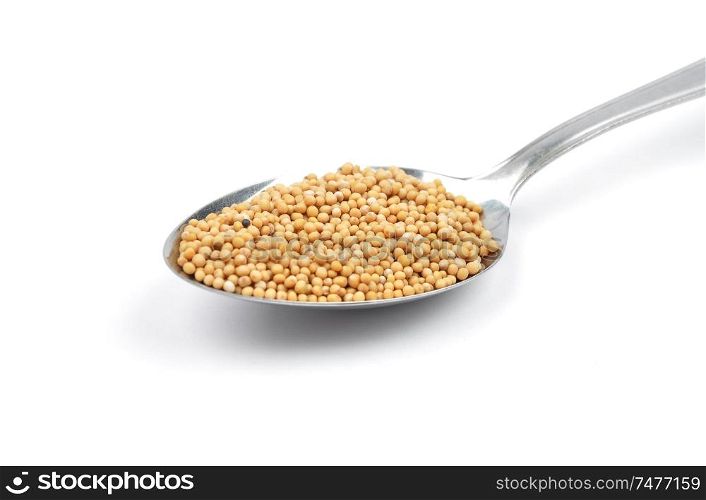 Mustard seeds on spoon