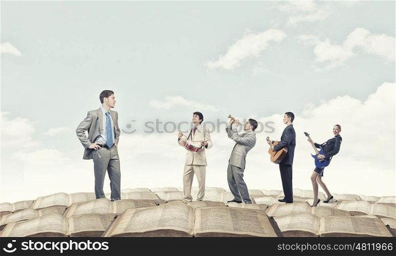 My art team. Businessman and colleagues playing different music instruments