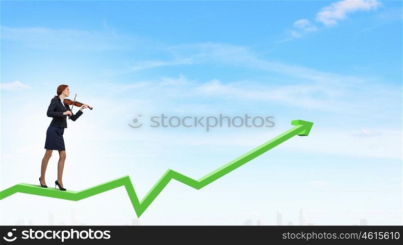 My business melody. Young businesswoman playing violin standing on growing graph