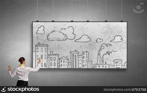 My development project. Rear view of businesswoman drawing buildings on white banner