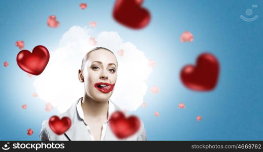 My favourite red pomade. Attractive woman applying red lipstick with brush