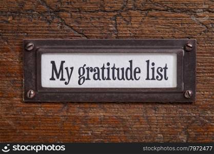 My gratitude list - a label on a grunge wooden file cabinet