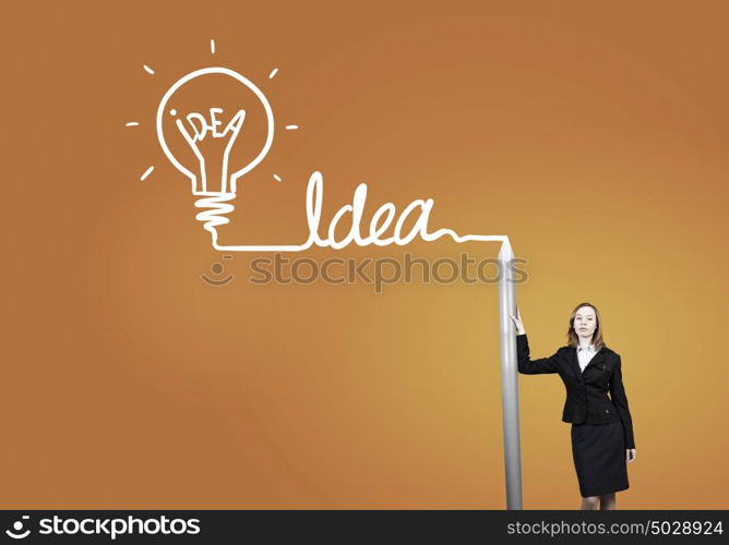 My great idea. Businesswoman drawing word idea with huge pencil