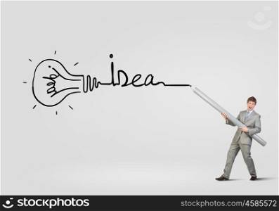My great plan. Businessman drawing word idea with huge pencil