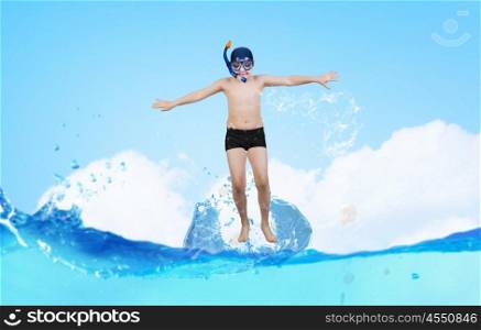 My great summer vacation. Kid boy in diving mask making jump in to water
