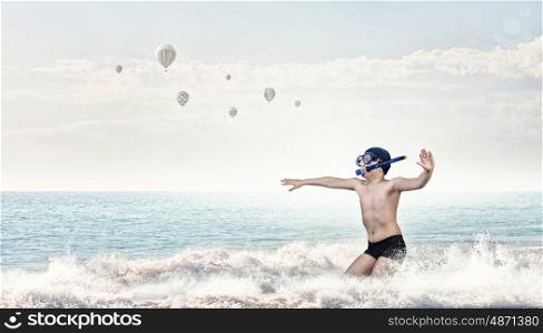 My great summer vacation. Kid boy of school age in diving mask having fun