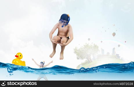 My great summer vacation. Kid boy of school age in diving mask jumping in water