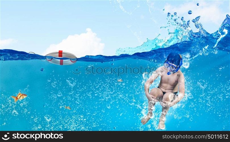 My great summer vacation. Kid boy of school age in diving mask jumping in water