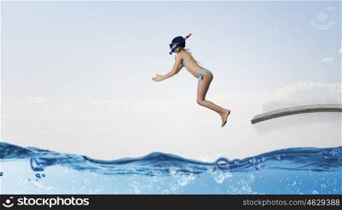 My great summer vacation. Kid girl in diving mask jumping in water