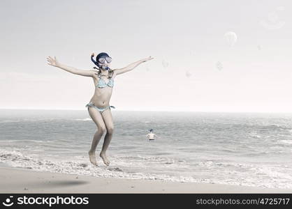 My great summer vacation. Kid girl in diving mask jumping in water