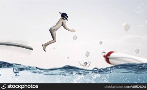 My great summer vacation. Kid girl in diving mask jumping in water