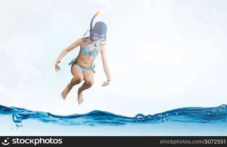 My great summer vacation. Kid girl in diving mask jumping in water