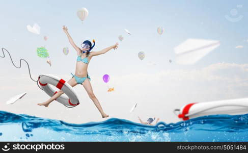 My great summer vacation. Kid girl of school age in diving mask swimming in life buoy