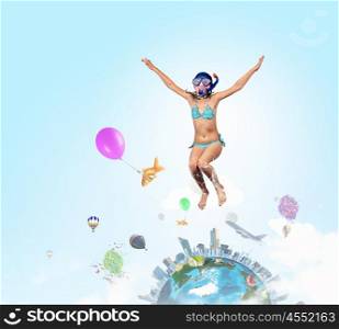 My great summer vacation. Kid girl of school age in diving mask having fun. Elements of this image are furnished by NASA