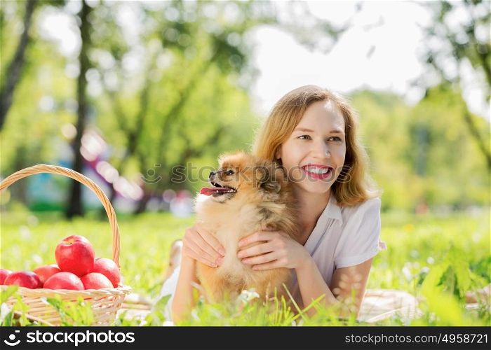 My lovely pet!. Young pretty girl in summer park with cute dog