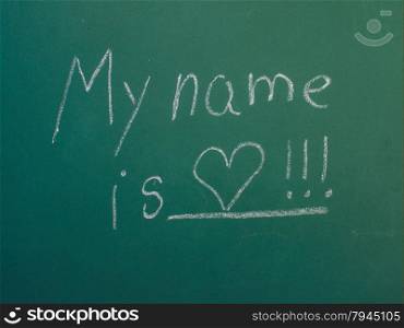My name is love, written in white chalk on green chalkboard